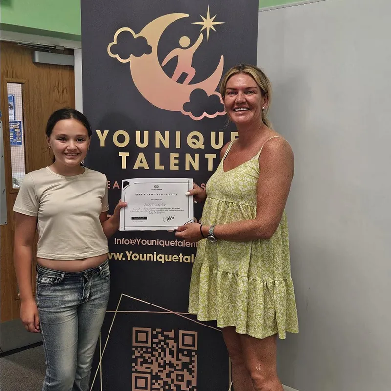 Younique Talent student receiving a training certificate